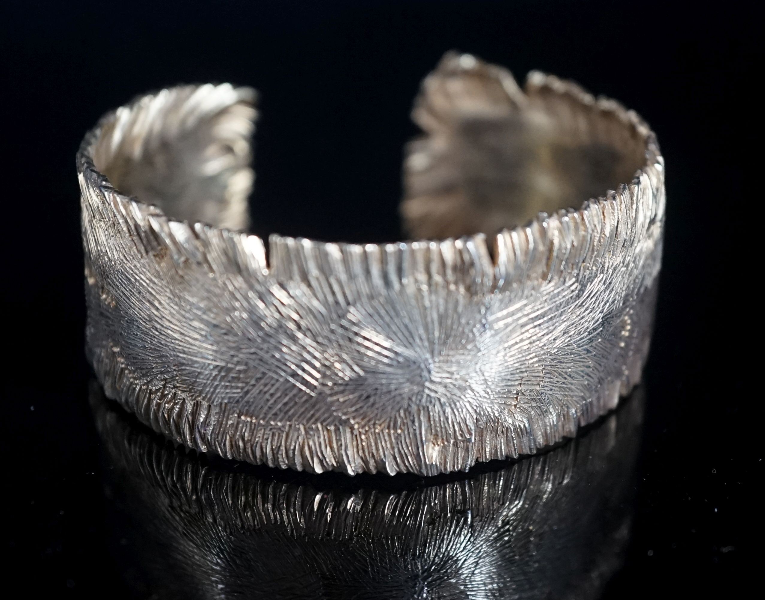 A modern silver gilt open bangle by Adrian Gerald Benney, London, 1962, with samorodok decoration, in original box, interior diameter approx. 60mm, 48 grams.